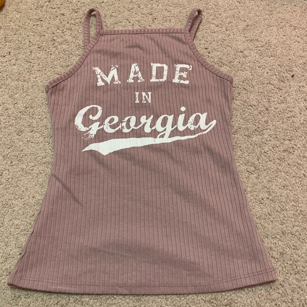 Tight fitting sleeveless shirt.